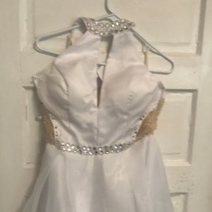 Brand new. Perfect condition white poly satin with poly chiffon overlay.  Neck